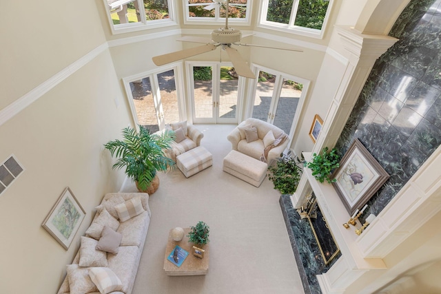 193 Honeybee Dr, Branson, MO 65615 - living room with a high ceiling, a ceiling fan, and a fireplace
