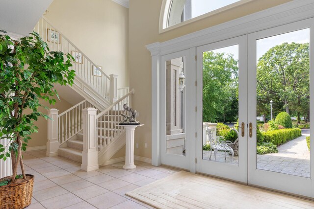193 Honeybee Dr, Branson, MO 65615 - tiled entrance foyer featuring french doors, stairs, and a towering ceiling