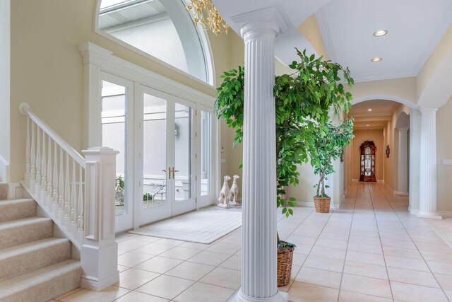 193 Honeybee Dr, Branson, MO 65615 - entryway with ornate columns, french doors, arched walkways, light tile patterned floors, and recessed lighting