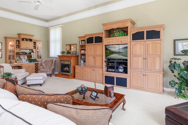 193 Honeybee Dr, Branson, MO 65615 - living room featuring light carpet, a warm lit fireplace, ceiling fan, and ornamental molding