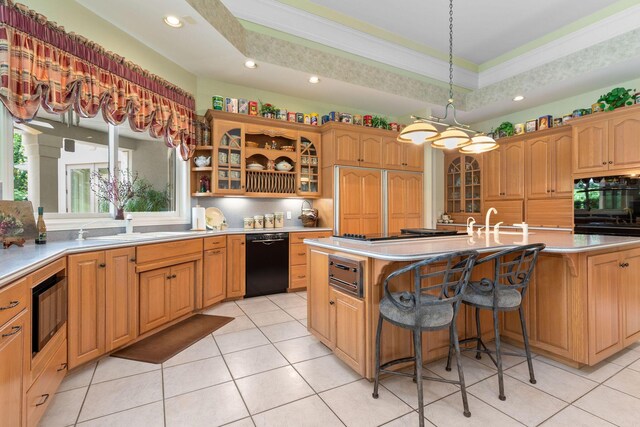 193 Honeybee Dr, Branson, MO 65615 - kitchen with black appliances, light tile patterned flooring, a kitchen island with sink, ornamental molding, and glass insert cabinets
