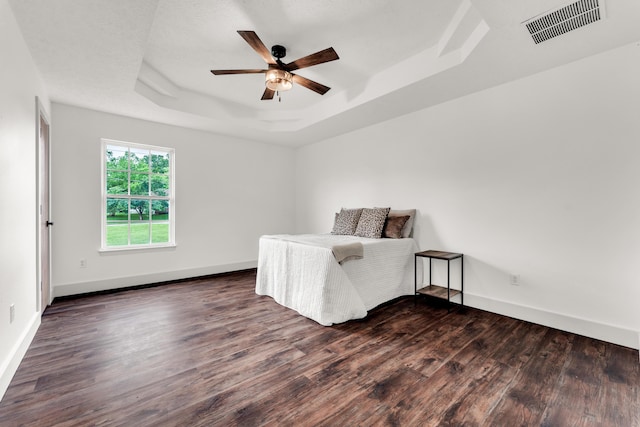 524 W Woodbine Rd, Nixa, MO 65714 - bedroom featuring a raised ceiling, dark wood-type flooring, baseboards, and a ceiling fan