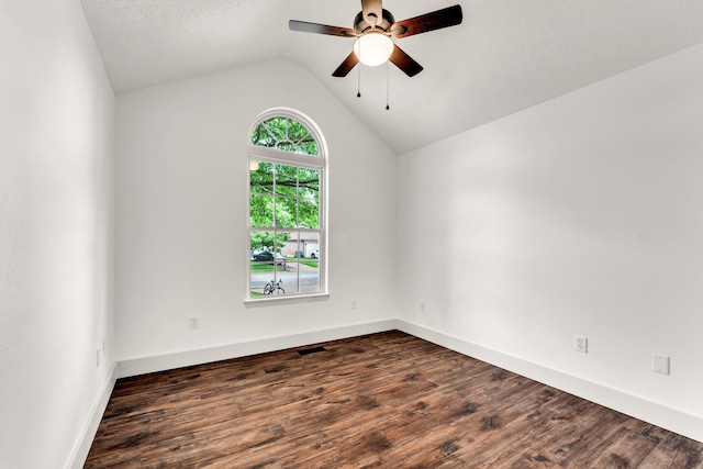 524 W Woodbine Rd, Nixa, MO 65714 - empty room with a ceiling fan, dark wood-style floors, lofted ceiling, and baseboards