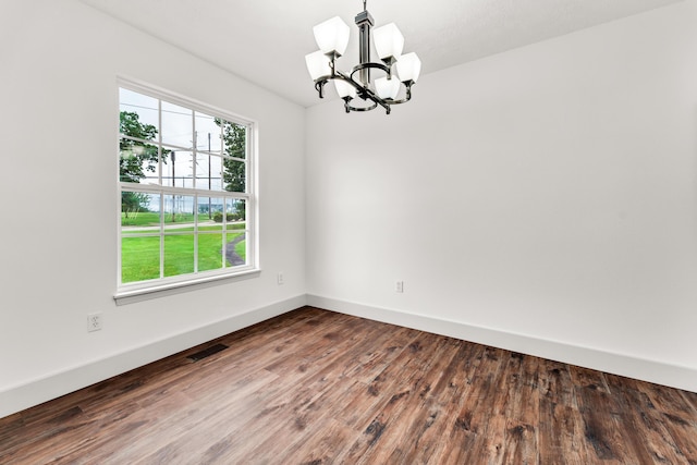 524 W Woodbine Rd, Nixa, MO 65714 - empty room with a chandelier, wood finished floors, and baseboards