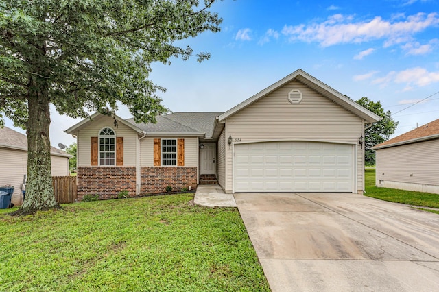 524 W Woodbine Rd, Nixa, MO 65714 - ranch-style house with driveway, a garage, and brick siding