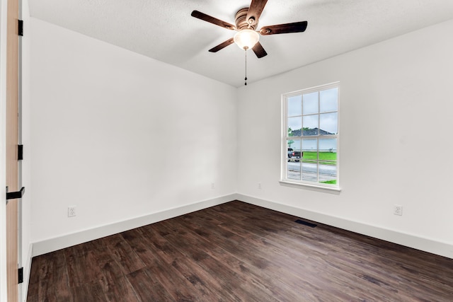 524 W Woodbine Rd, Nixa, MO 65714 - spare room featuring dark wood-type flooring, a ceiling fan, and baseboards