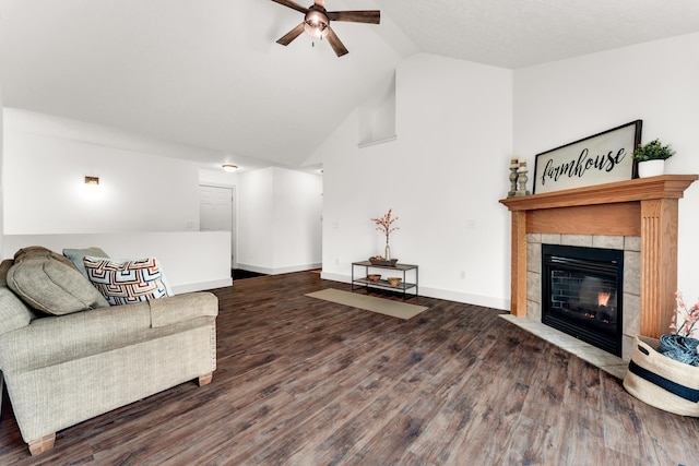 524 W Woodbine Rd, Nixa, MO 65714 - living room with a ceiling fan, wood finished floors, a tiled fireplace, baseboards, and high vaulted ceiling