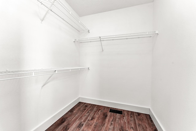 524 W Woodbine Rd, Nixa, MO 65714 - spacious closet featuring dark wood-style floors