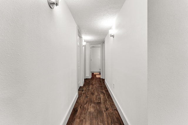 524 W Woodbine Rd, Nixa, MO 65714 - corridor with wood finished floors, baseboards, and a textured ceiling