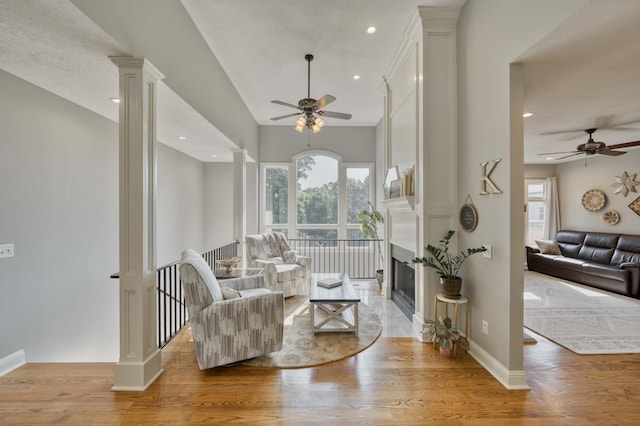 1865 N Hearthstone Ln, Strafford, MO 65757 - living area with ceiling fan, decorative columns, healthy amount of natural light, light wood-style flooring, and recessed lighting
