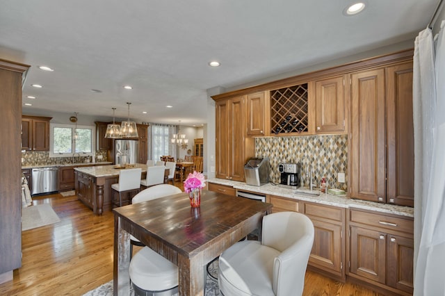1865 N Hearthstone Ln, Strafford, MO 65757 - dining room with recessed lighting, light wood-style flooring, a chandelier, and bar area