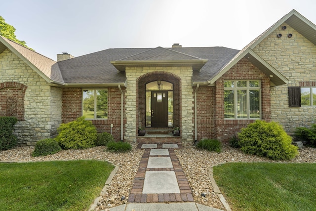 1865 N Hearthstone Ln, Strafford, MO 65757 - entrance to property with a chimney, roof with shingles, and stone siding