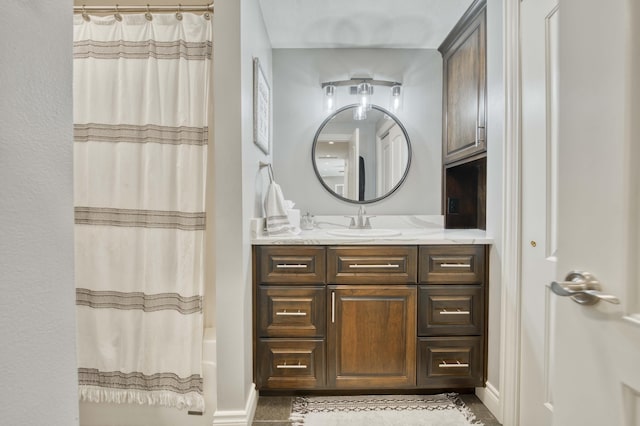 1865 N Hearthstone Ln, Strafford, MO 65757 - bathroom with vanity, shower / bath combo, and baseboards