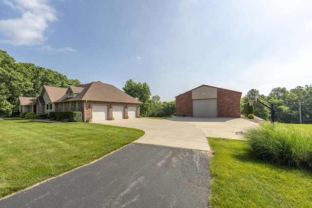 1865 N Hearthstone Ln, Strafford, MO 65757 - view of front of home featuring brick siding, a front lawn, and an outdoor structure