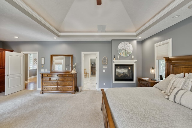 1865 N Hearthstone Ln, Strafford, MO 65757 - carpeted bedroom with ornamental molding, a raised ceiling, recessed lighting, a multi sided fireplace, and baseboards