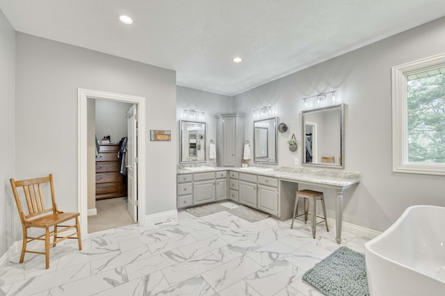 1865 N Hearthstone Ln, Strafford, MO 65757 - full bathroom featuring a soaking tub, recessed lighting, marble look tile flooring, vanity, and baseboards