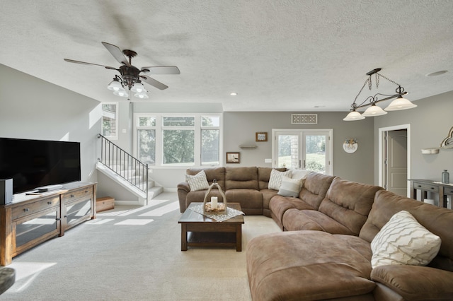 1865 N Hearthstone Ln, Strafford, MO 65757 - living area with light colored carpet, a textured ceiling, ceiling fan, and stairway
