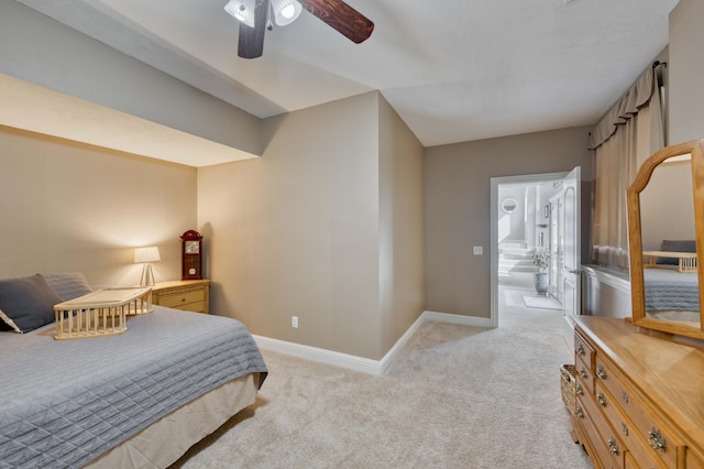 1865 N Hearthstone Ln, Strafford, MO 65757 - bedroom with light carpet, baseboards, ensuite bathroom, and ceiling fan