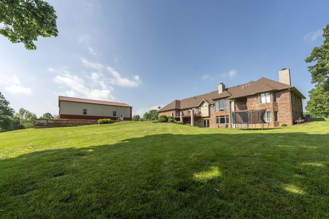 1865 N Hearthstone Ln, Strafford, MO 65757 - view of grassy yard with a trampoline