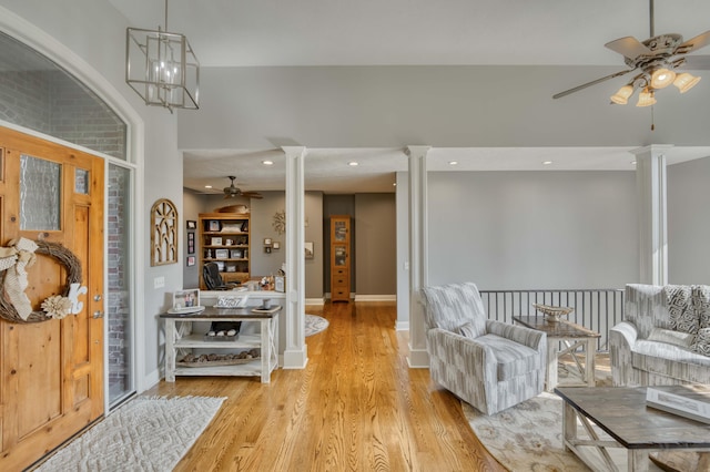 1865 N Hearthstone Ln, Strafford, MO 65757 - living room featuring decorative columns, ceiling fan, light wood-style floors, baseboards, and recessed lighting