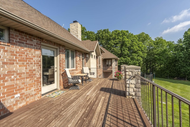 1865 N Hearthstone Ln, Strafford, MO 65757 - wooden deck with a lawn