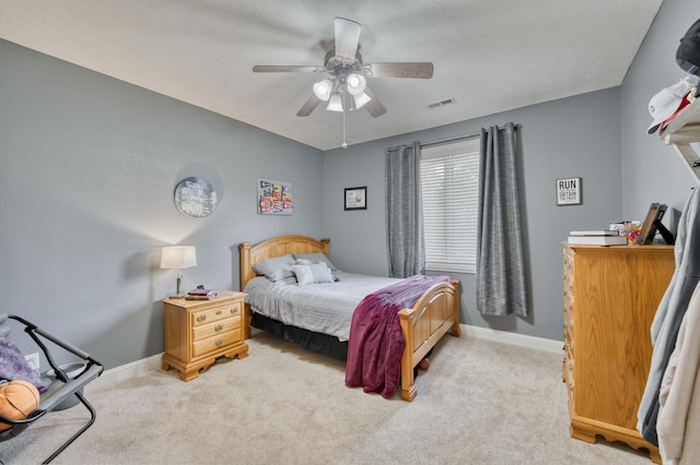 1865 N Hearthstone Ln, Strafford, MO 65757 - bedroom featuring light carpet, baseboards, and a ceiling fan