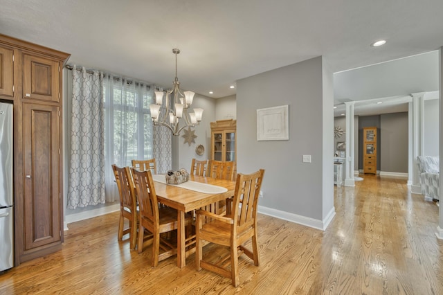 1865 N Hearthstone Ln, Strafford, MO 65757 - dining area featuring light wood-style floors, baseboards, a chandelier, recessed lighting, and ornate columns