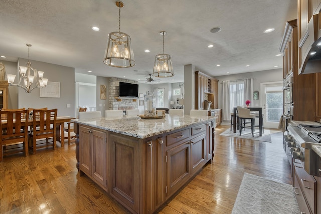 1865 N Hearthstone Ln, Strafford, MO 65757 - kitchen with recessed lighting, plenty of natural light, pendant lighting, and a kitchen island