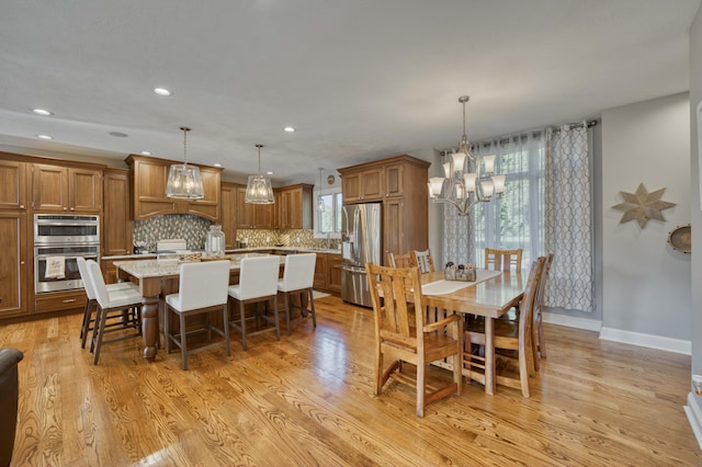 1865 N Hearthstone Ln, Strafford, MO 65757 - dining room featuring a chandelier, light wood-style flooring, recessed lighting, and baseboards