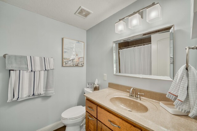 1865 N Hearthstone Ln, Strafford, MO 65757 - bathroom with vanity, toilet, and curtained shower
