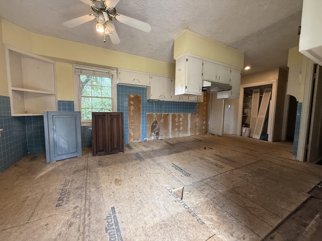404 S 5th St, Thayer, MO 65791 - kitchen with a textured ceiling, ceiling fan, and white cabinetry