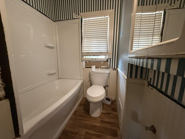 404 S 5th St, Thayer, MO 65791 - bathroom featuring wood finished floors, toilet, wallpapered walls, and wainscoting