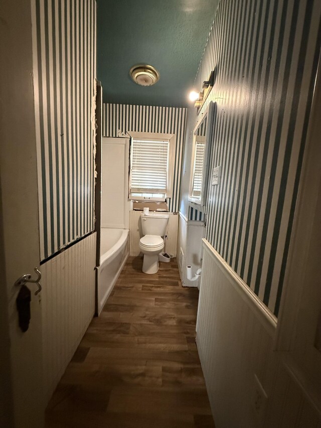 404 S 5th St, Thayer, MO 65791 - bathroom with wallpapered walls, toilet, wood finished floors, shower / washtub combination, and vanity