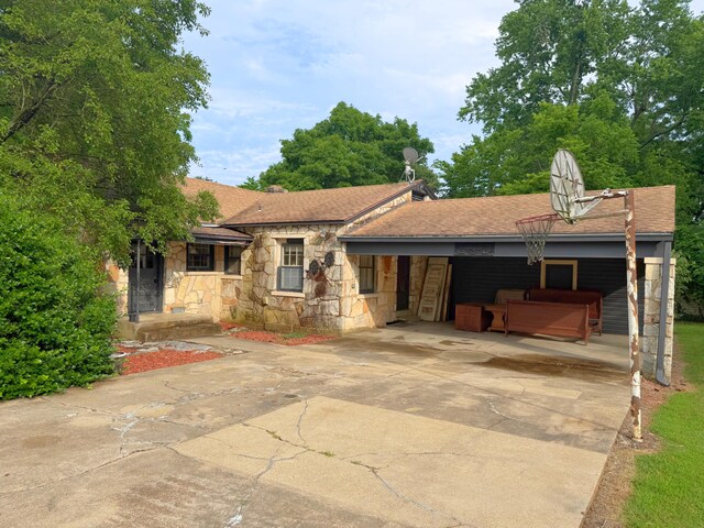 404 S 5th St, Thayer, MO 65791 - view of front of house featuring stone siding, driveway, and a shingled roof