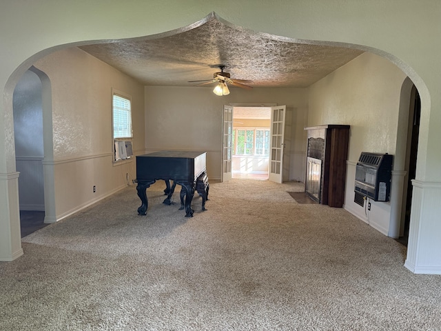 404 S 5th St, Thayer, MO 65791 - playroom featuring ceiling fan, plenty of natural light, heating unit, a textured ceiling, and carpet