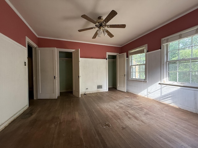 404 S 5th St, Thayer, MO 65791 - unfurnished bedroom with hardwood / wood-style floors, multiple closets, crown molding, ceiling fan, and baseboards
