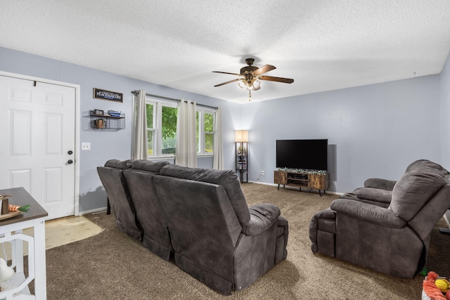 668 W Springfield St, Aurora, MO 65605 - living room with carpet flooring, a ceiling fan, a textured ceiling, and baseboards