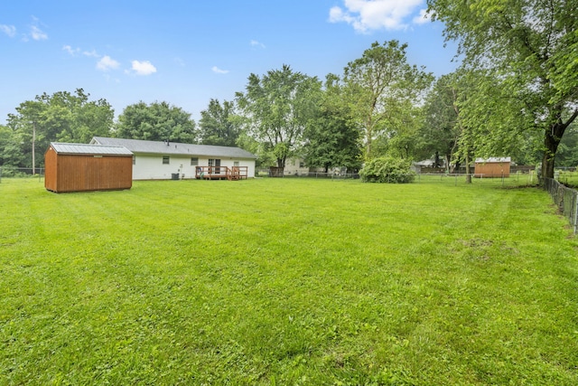 668 W Springfield St, Aurora, MO 65605 - view of yard featuring a wooden deck and view of scattered trees