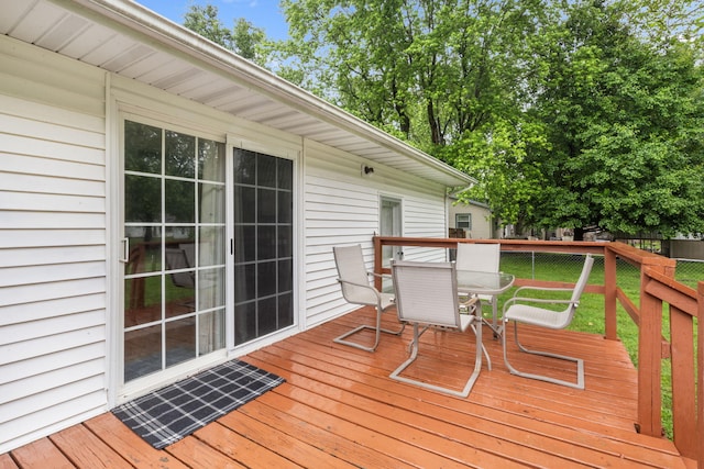 668 W Springfield St, Aurora, MO 65605 - wooden deck with outdoor dining area