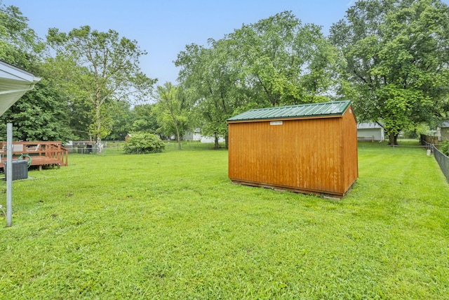 668 W Springfield St, Aurora, MO 65605 - view of yard with central AC and view of wooded area