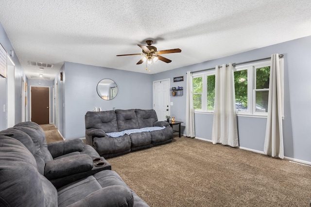 668 W Springfield St, Aurora, MO 65605 - carpeted living room with attic access, ceiling fan, a textured ceiling, and baseboards