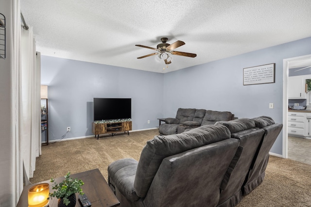 668 W Springfield St, Aurora, MO 65605 - living area with carpet floors, ceiling fan, baseboards, and a textured ceiling