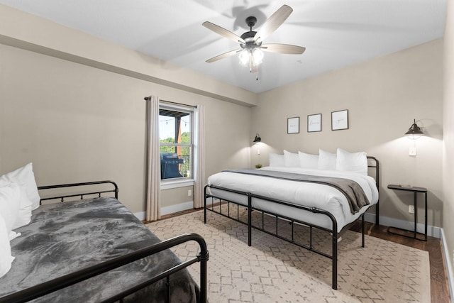 440 Lake Front Dr, Branson, MO 65616 - bedroom featuring baseboards, wood finished floors, and a ceiling fan