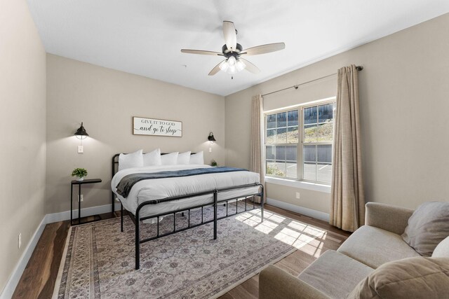 440 Lake Front Dr, Branson, MO 65616 - bedroom with baseboards, wood finished floors, and a ceiling fan