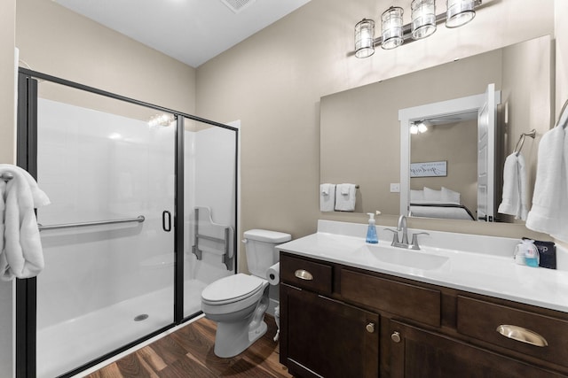 440 Lake Front Dr, Branson, MO 65616 - bathroom with a shower stall, wood finished floors, vanity, toilet, and connected bathroom