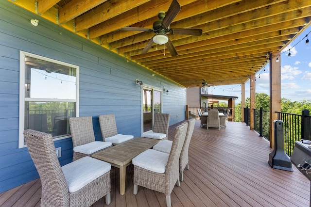 440 Lake Front Dr, Branson, MO 65616 - wooden deck with outdoor dining space and a ceiling fan