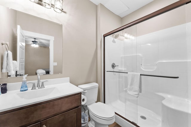 440 Lake Front Dr, Branson, MO 65616 - full bathroom with a shower stall, toilet, vanity, connected bathroom, and a ceiling fan