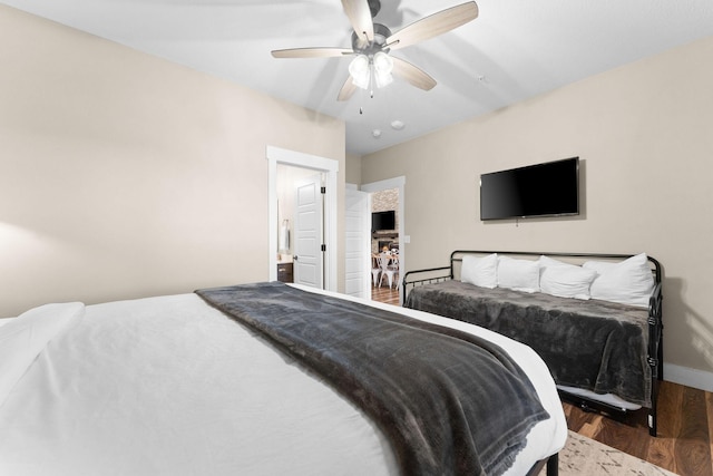 440 Lake Front Dr, Branson, MO 65616 - bedroom with wood finished floors, baseboards, and ceiling fan