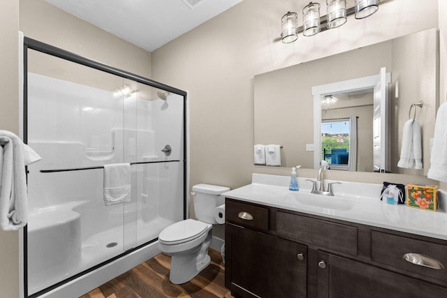 440 Lake Front Dr, Branson, MO 65616 - full bath featuring wood finished floors, a stall shower, vanity, and toilet