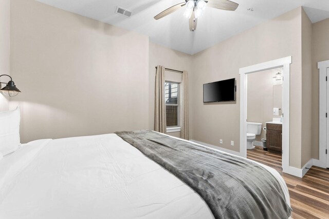 440 Lake Front Dr, Branson, MO 65616 - bedroom with wood finished floors, baseboards, ensuite bath, and a ceiling fan